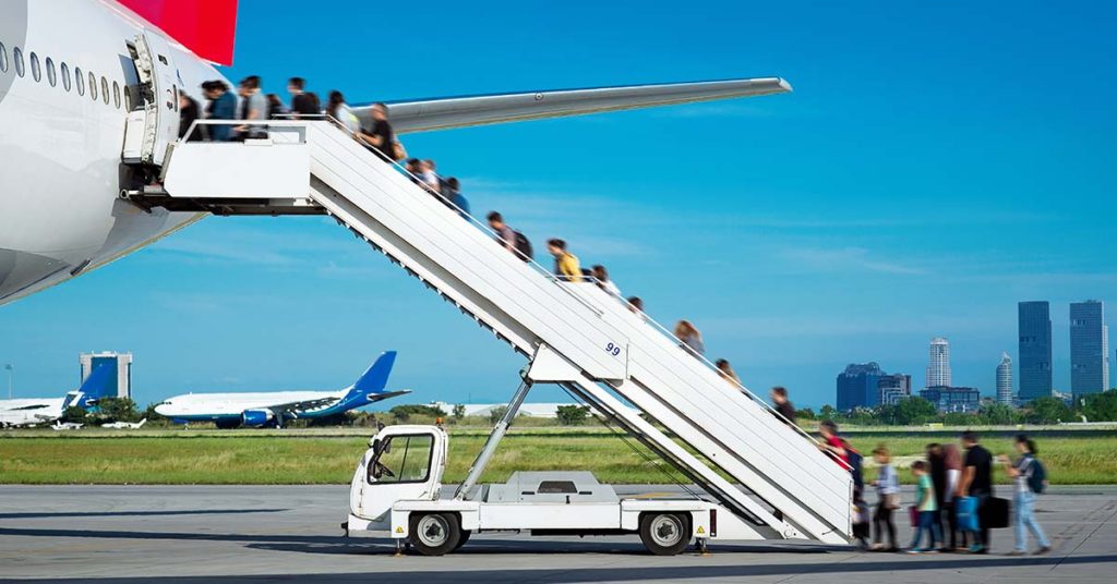 Many Travellers Do The Exact Same Superstitious Gesture Before Getting on a Plane - Featured image