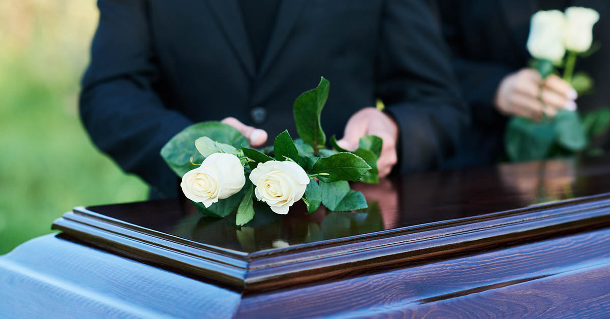 Casket with flowers placed on top