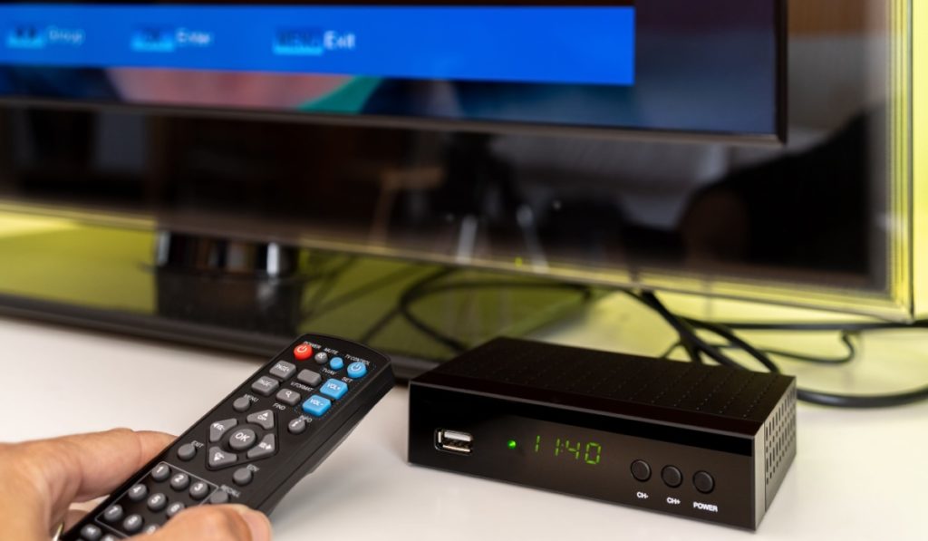 Digital decoder for new television transmission with remote control and television monitor.