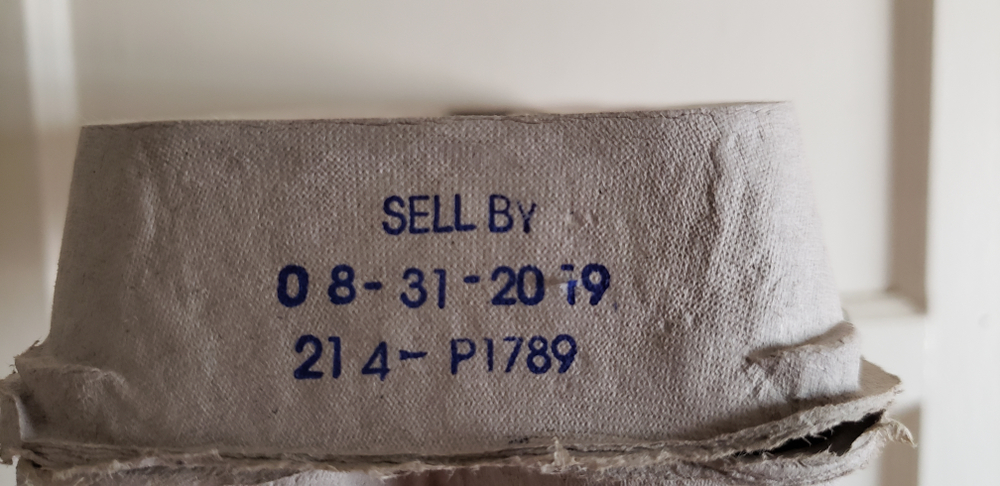 "Los Angeles, CA / USA - August 29, 2019: Sell By Date 08-31-2019 Expired Eggs Possible Salmonella Poisoning.  Plain Egg Carton. 