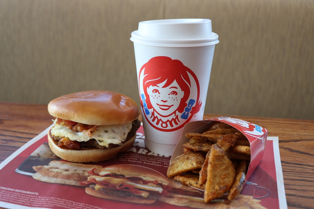 MIAMI, FLORIDA USA - 08-22-2022
Breakfast Baconator, breakfast potatoes, and a cup of coffee at a Wendy's restaurant.