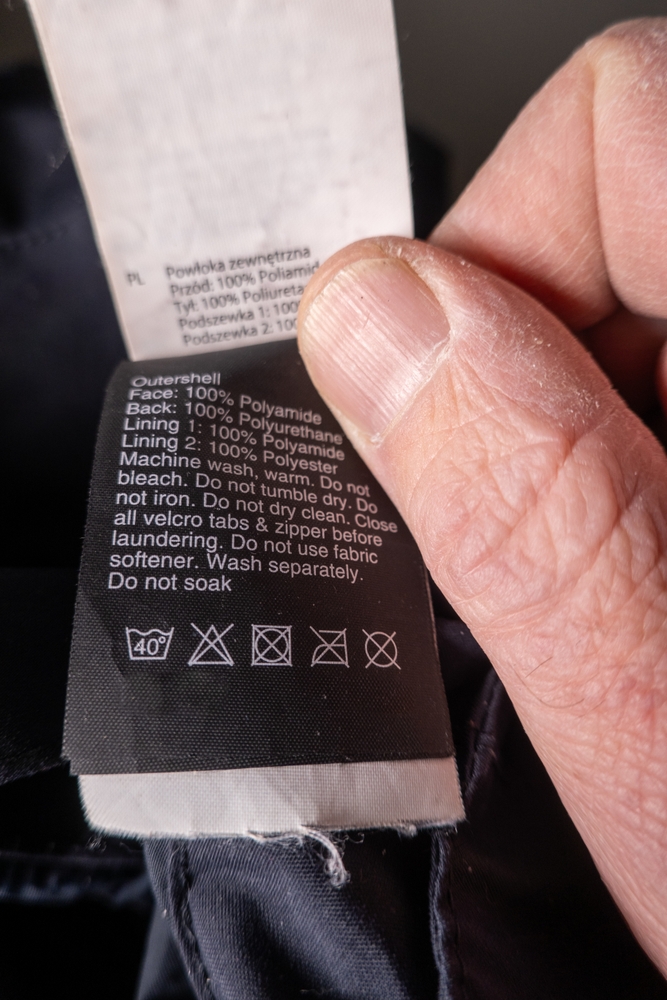 A washing lable on a piece of clothing.