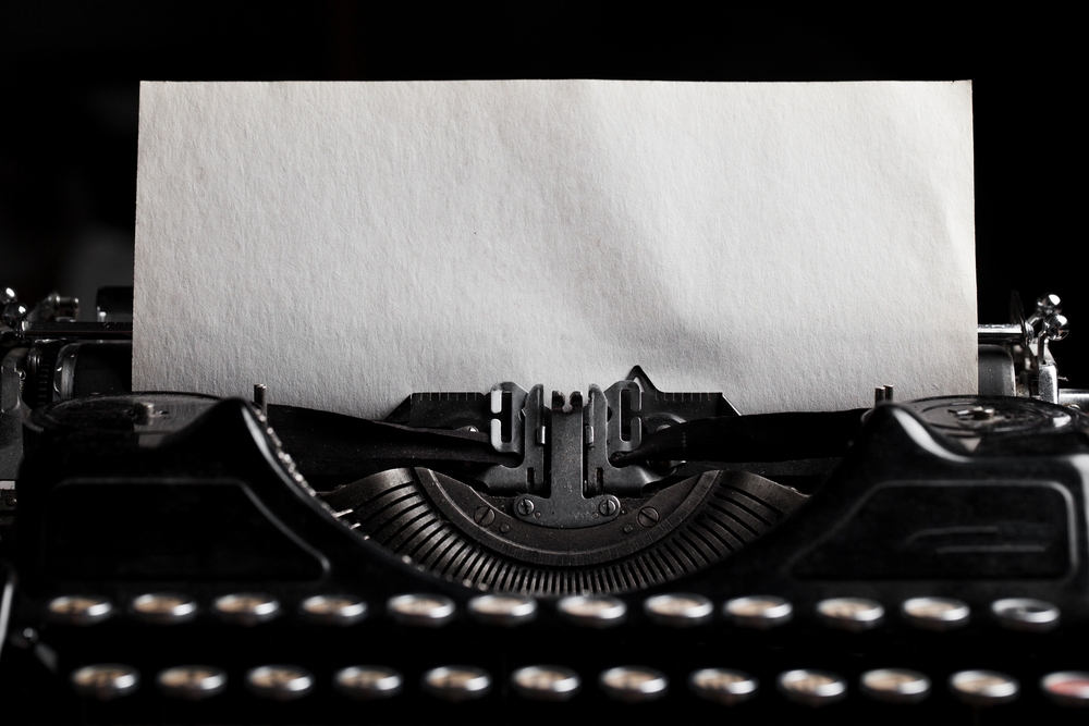typewriter with paper sheet. Space for your text