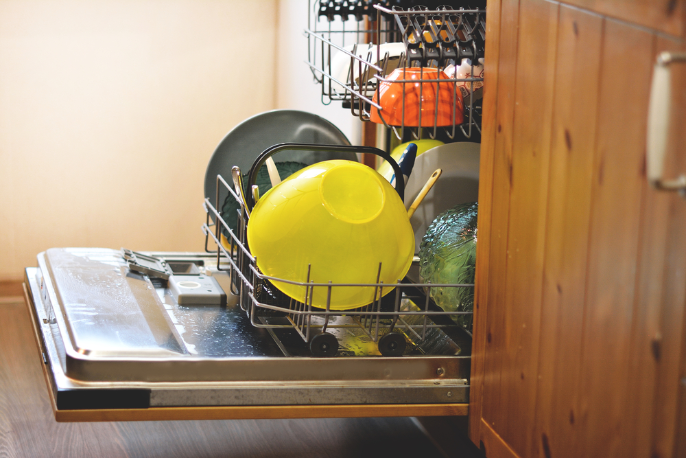 opened dishwasher with clean dishes, toned