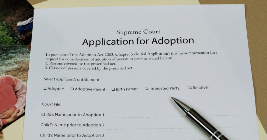 Adoption Papers laid out ready for completion.