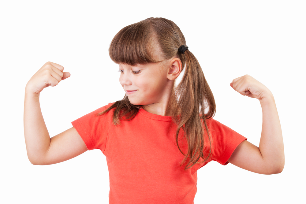Cute little girl shows us their biceps