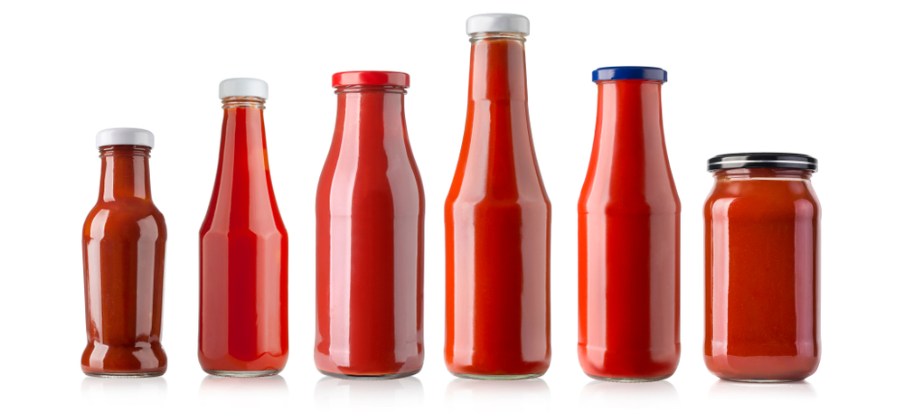 the various barbecue sauces in glass bottles