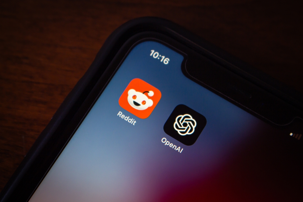 Vancouver, CANADA - May 20 2024 : Reddit and OpenAI icons seen in an iPhone. OpenAI and Reddit announced a partnership to enhance ChatGPT with Reddit content and improve Reddit's UX with AI features.