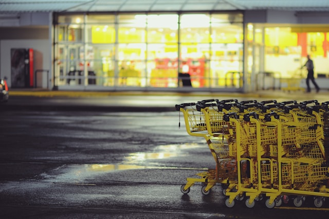 trolleys in front of a grocery store