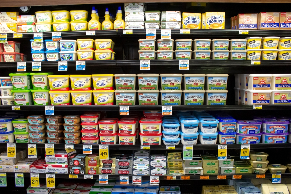 Los Angeles, California, United States - 05-20-2022: A view of several shelves dedicated to variety of butter brands, on display at a local grocery store.