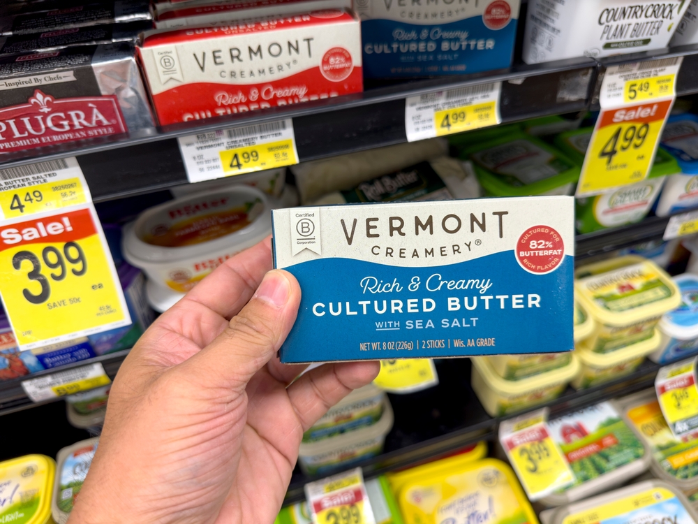Los Angeles, California, United States - 04-14-2024: A view of a hand holding a package of Vermont Creamery butter, on display at a local grocery store.