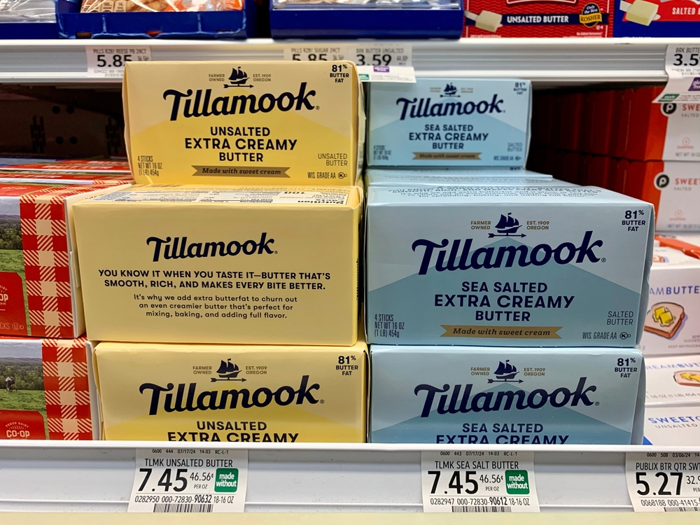 Boca Raton, FL USA - September 7, 2024: A close-up of Tillamook unsalted and sea salted extra creamy butter on a shelf with price in Publix.