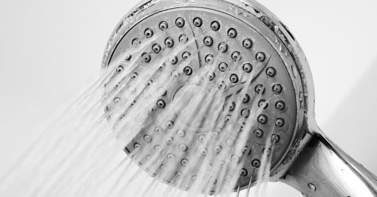How To Unclog Your Showerhead Holes and Increase Water Pressure - Featured image