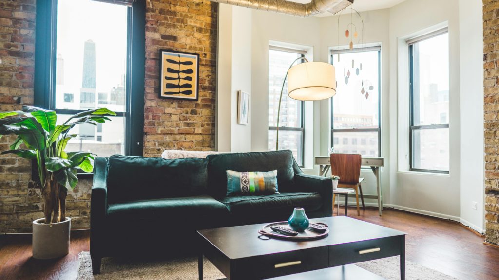 brown and white living room with table