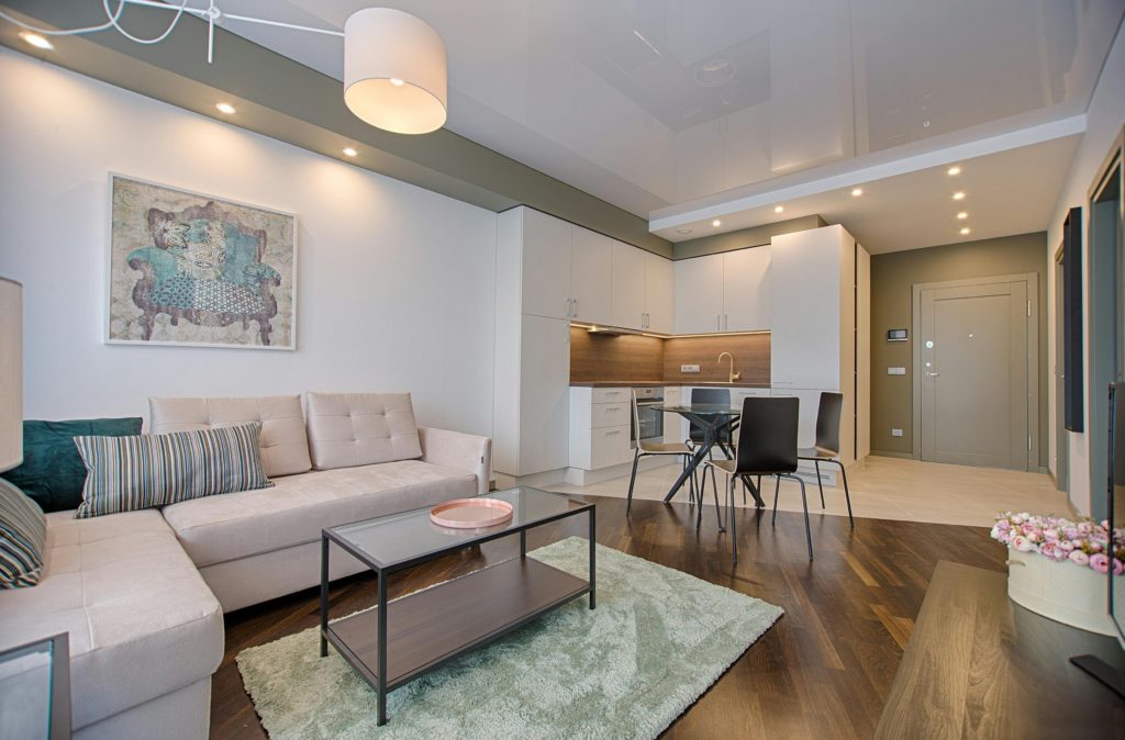 white and wooden living room with table