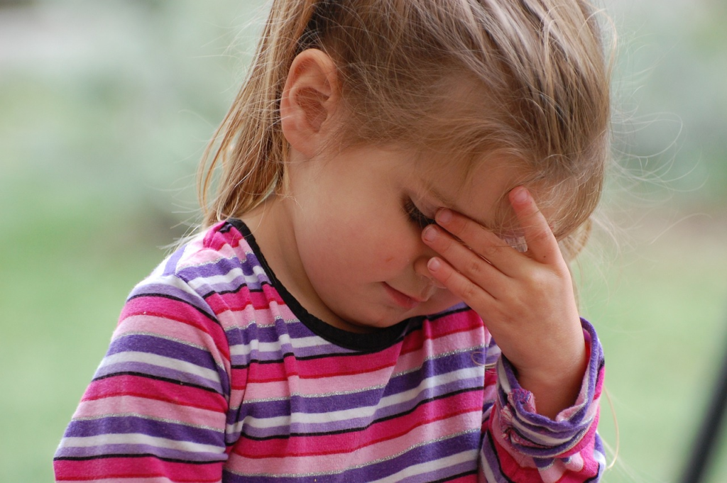 young girl looking hurt