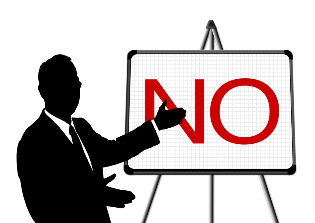 silhouette of a man presenting the word NO