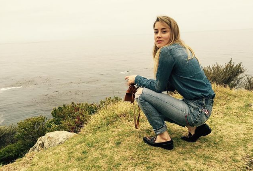 amber heard in spain living a new life, camera in hand