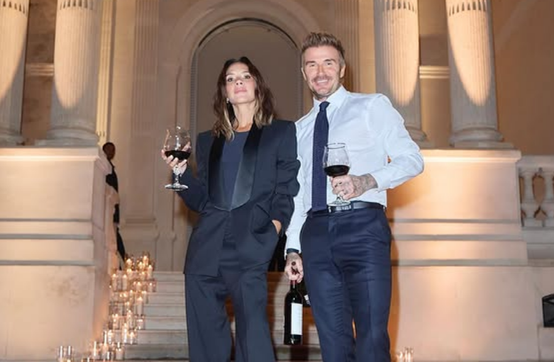 david and victoria beckham with candles and a bottle of wine