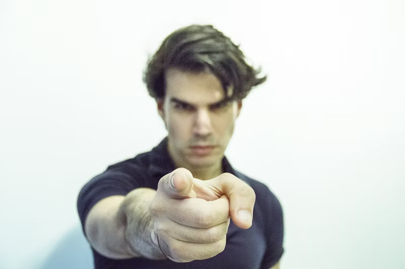a person pointing a finger