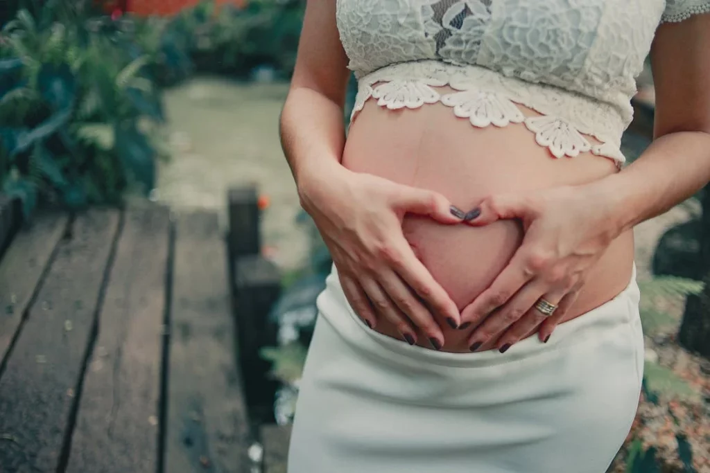 pregnant woman wearing white skirt