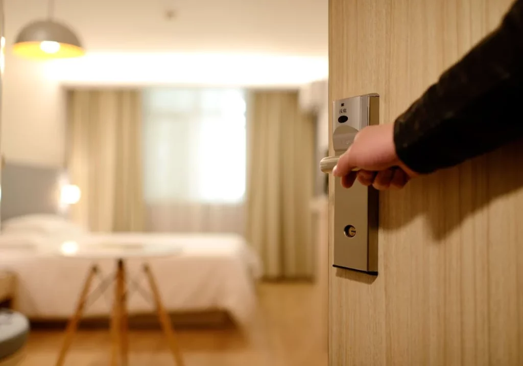 man holding hotel door open