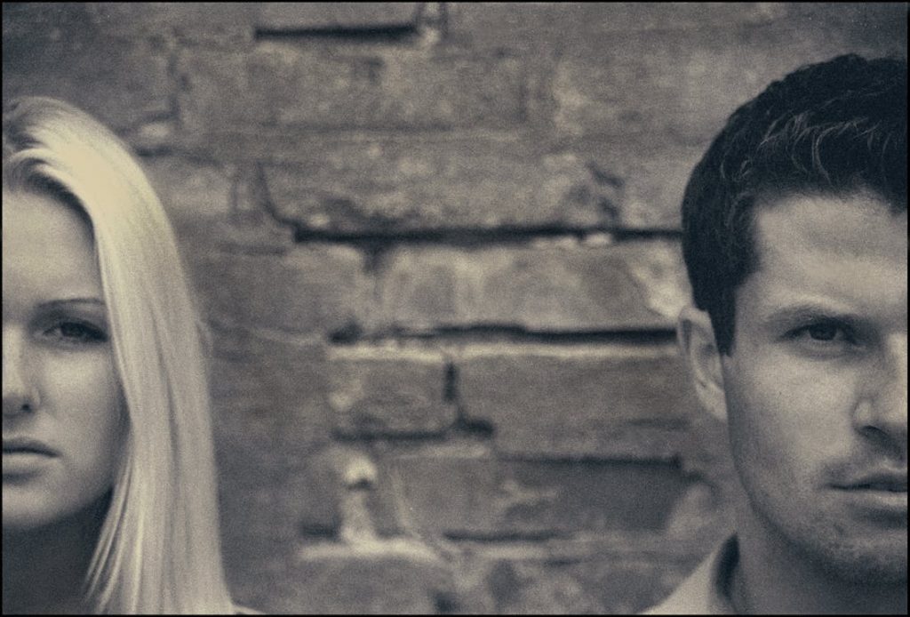 upset couple glaring at the camera