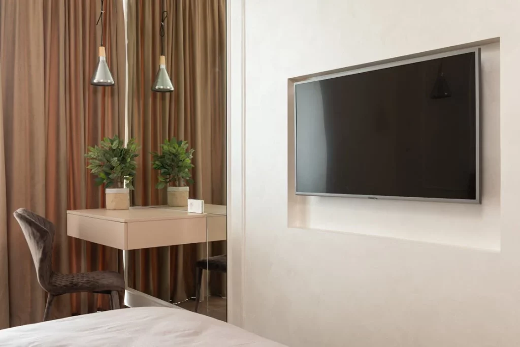 television mounted on to hotel wall