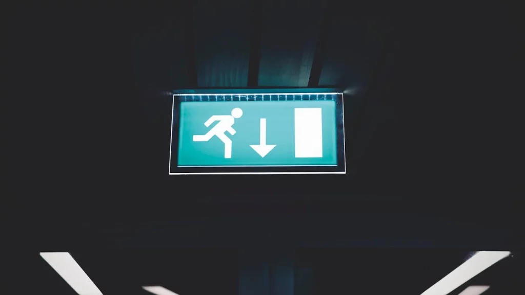 green emergency exit sign illuminated