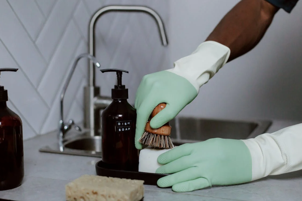 Start by using a sink-cleaning brush or pipe cleaner to remove visible dirt from the overflow hole.