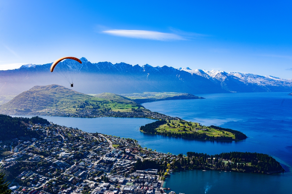 Queenstown landscape with a tranquil, azure lake in New Zealand
