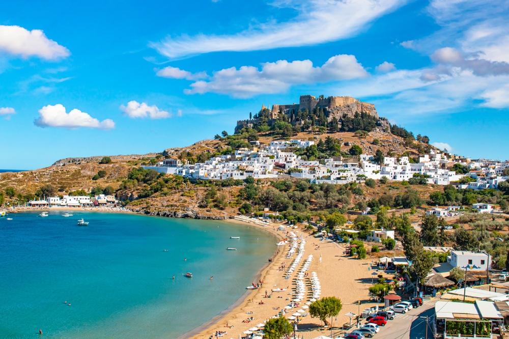 Rhodes, Greece. Lindos small whitewashed village and the Acropolis, scenery of Rhodos Island at Aegean Sea.