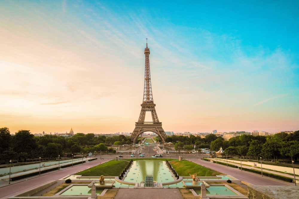 Paris Eiffel Tower and Trocadero garden at sunset in Paris, France. Eiffel Tower is one of the most famous landmarks of Paris.