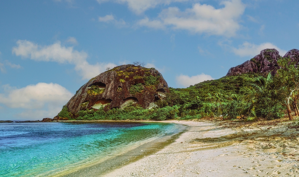 A beach in a tropical island, Fiji. View of Kuata Island palm beach in the Yasawa archipelago, Fiji