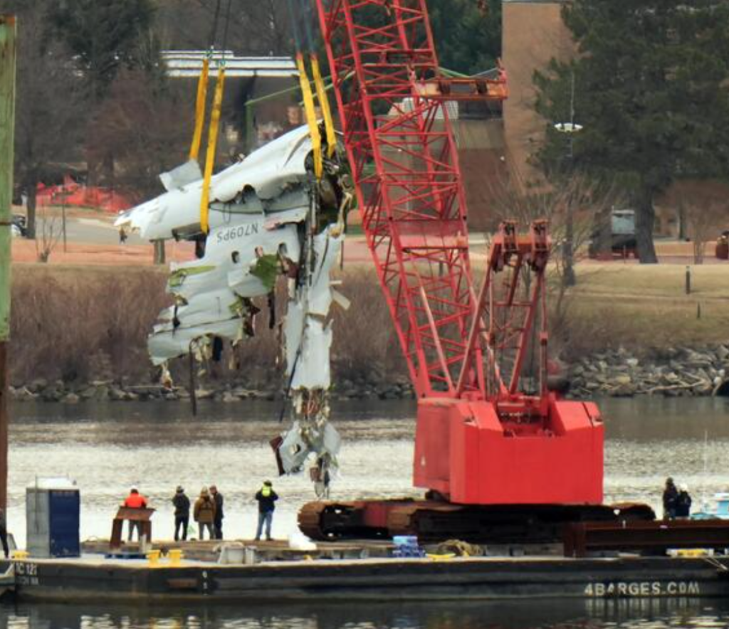 cleaning up the wreckage of the crash