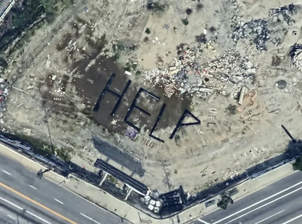 HELP spelled out several times on the property