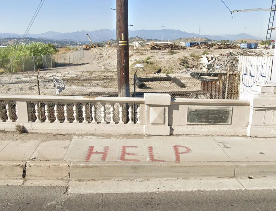 HELP also spelled on the sidewalk outside the Union Pacific property