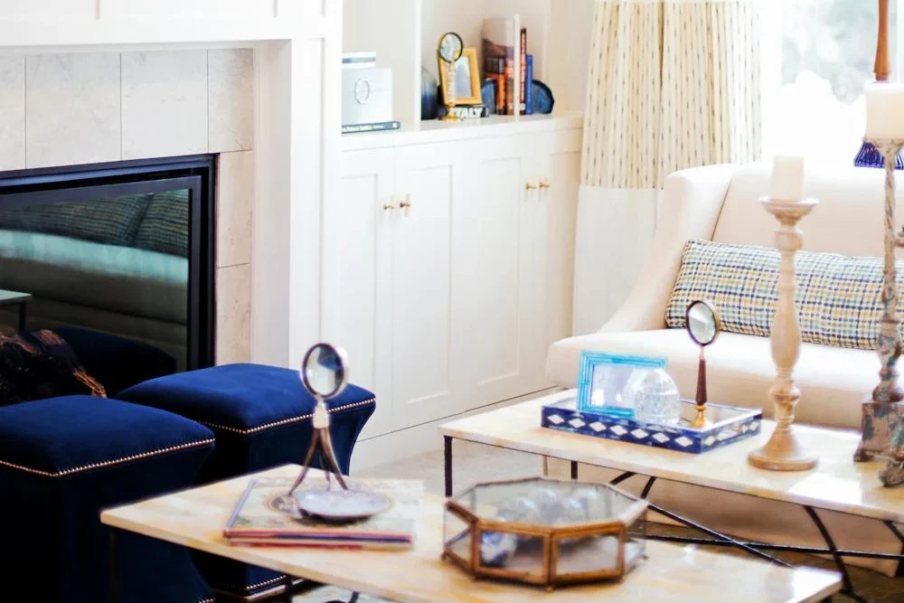 cluttered room with furniture and tables