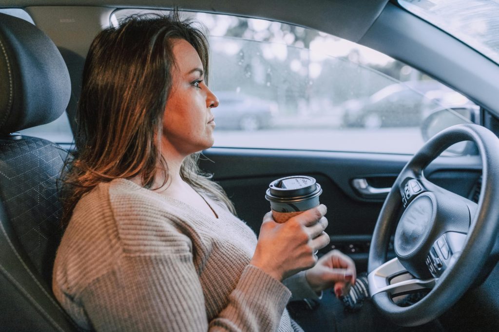 Woman holding a Disposable Cup