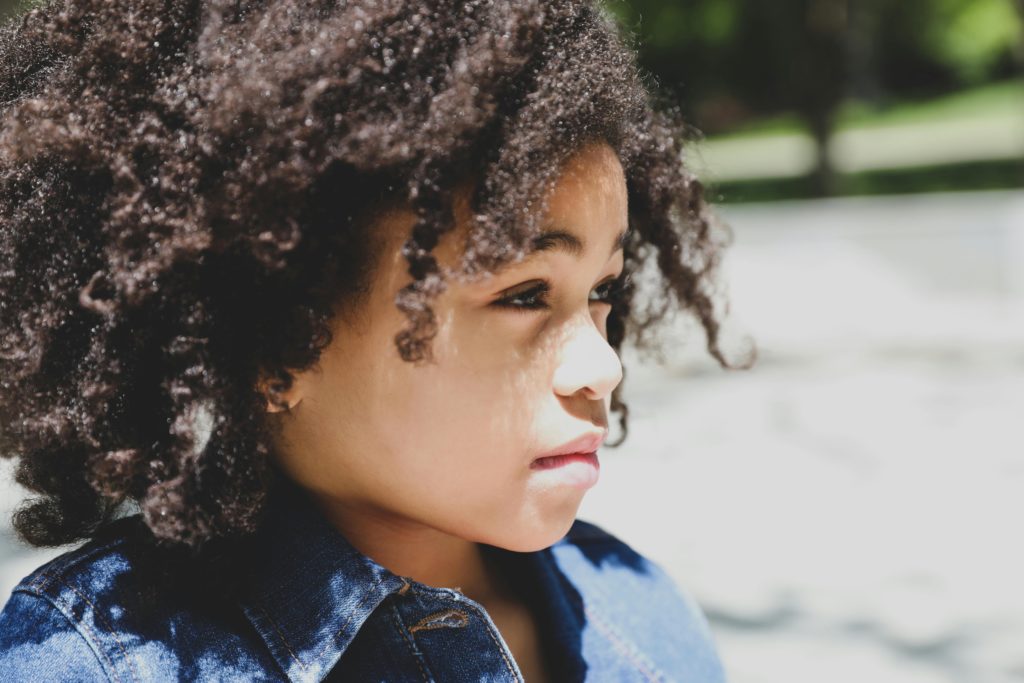Portrait of a Child in Bright Sunlight