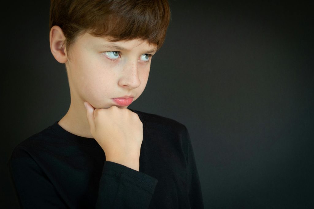 Boy with Brown Hair Pouting