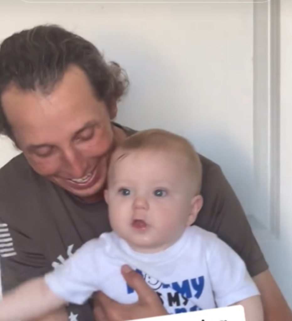 Wesley holding baby Levi