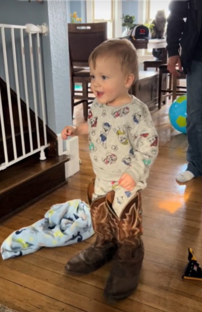 toddler wearing cowboy boots