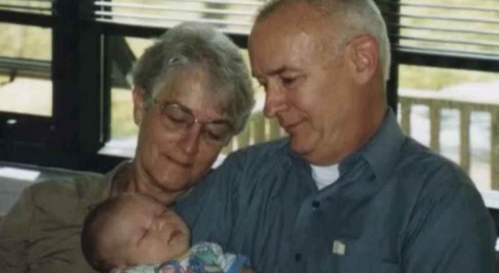 Andrew's parents holding baby Zachary