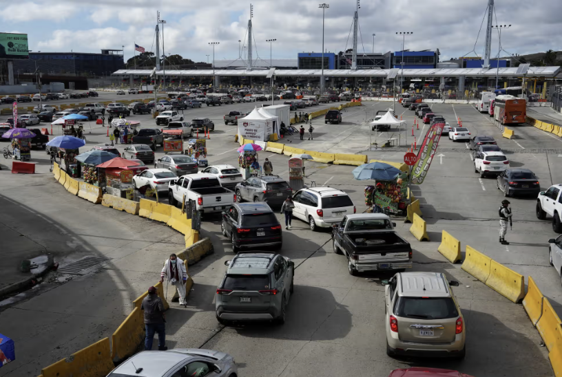 Vehicles queue at the San Ysidro border crossing between Mexico and the US, in Tijuana, Mexico, this month