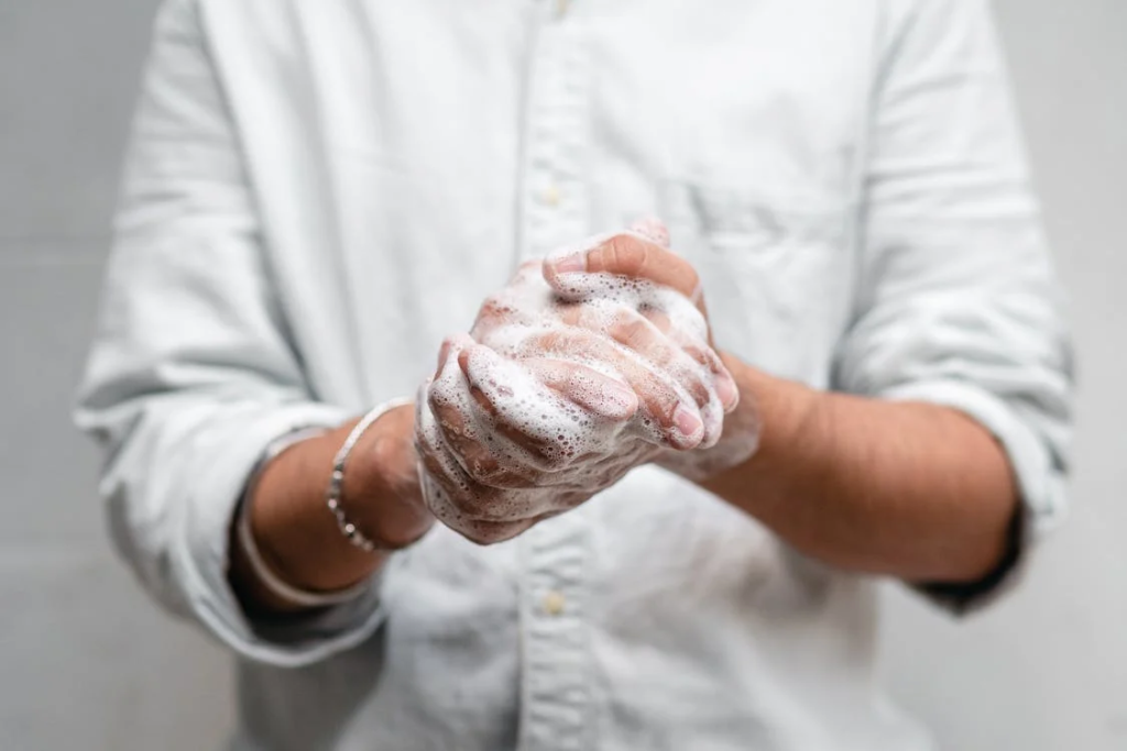 Person Washing Hands to prevent that old people smell
