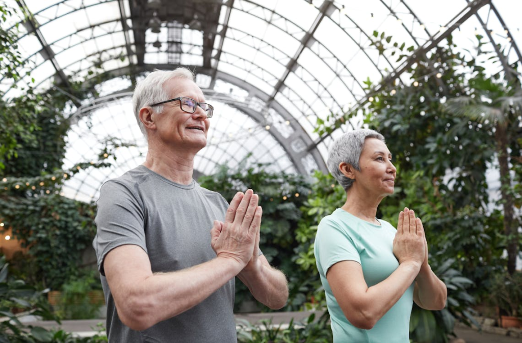 Couple Practicing Yoga to prevent old people smell