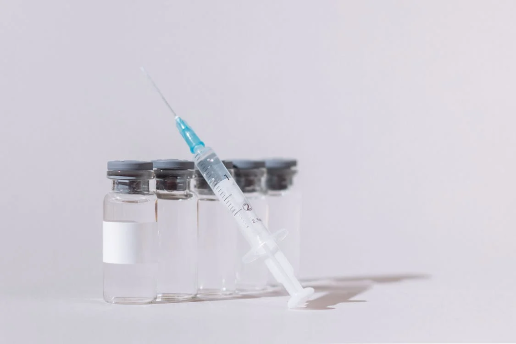 Covid Vaccine Bottles and Syringe