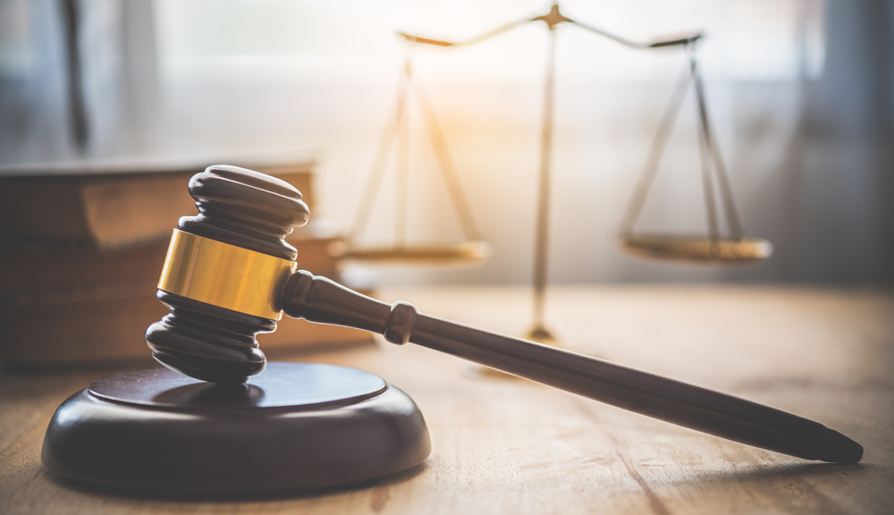 Law theme, mallet of the judge, law enforcement officers, evidence-based cases and documents taken into account.