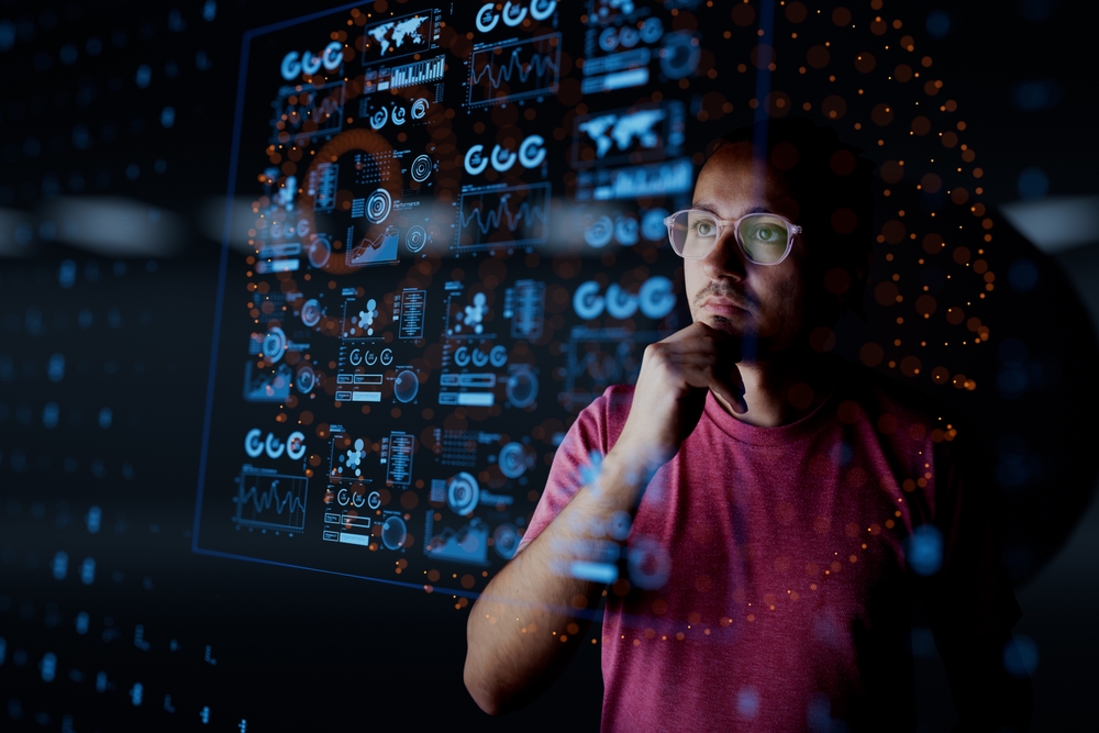Man look at the dashboard with graphs and charts. Concept of data management system, business intelligence, data statistics, marketing analysis, key performance indicators (KPI) and analytics.